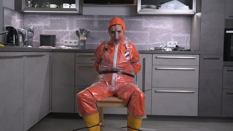 Amira in orange AGU rainwear and transparent bibpants and raincoat hard gagged