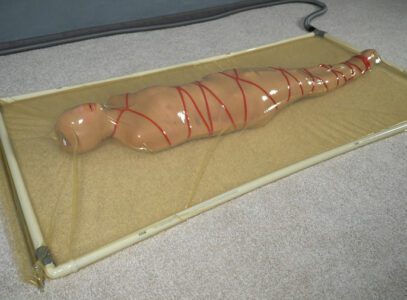 VACUUM DREAMS – Mummification with bandages and rope bondage with ankle brace in a vacuum bed